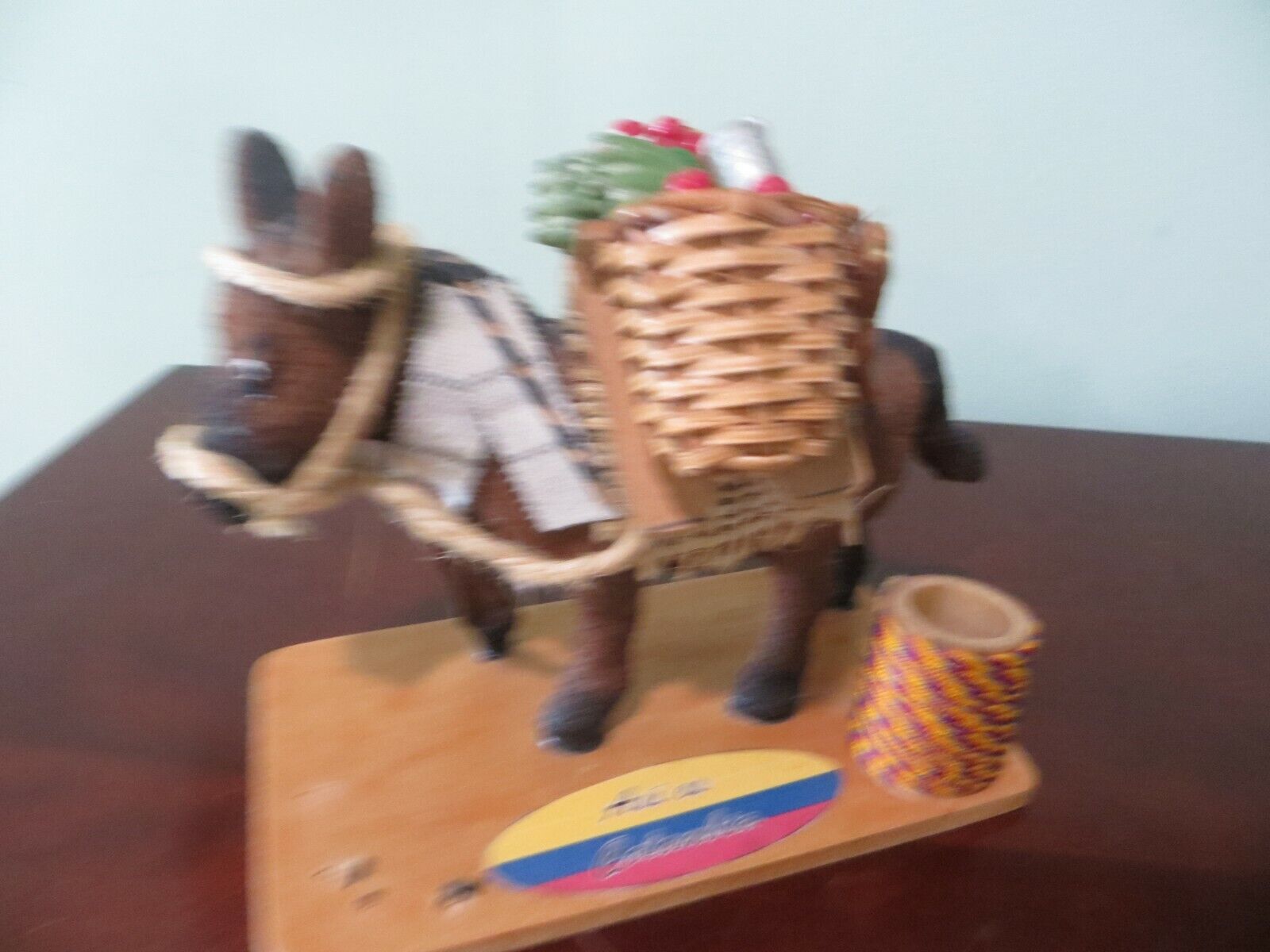 Asi es Columbia donkey hauling banana\'s and red fruit and a guitar, match holder