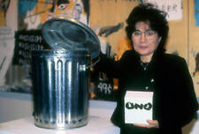 Yoko Ono poses with a garbage pail as a self-effacing comment on - Old Photo 1 picture