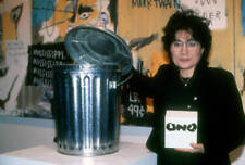 Yoko Ono poses with a garbage pail as a self-effacing comment on - Old Photo picture