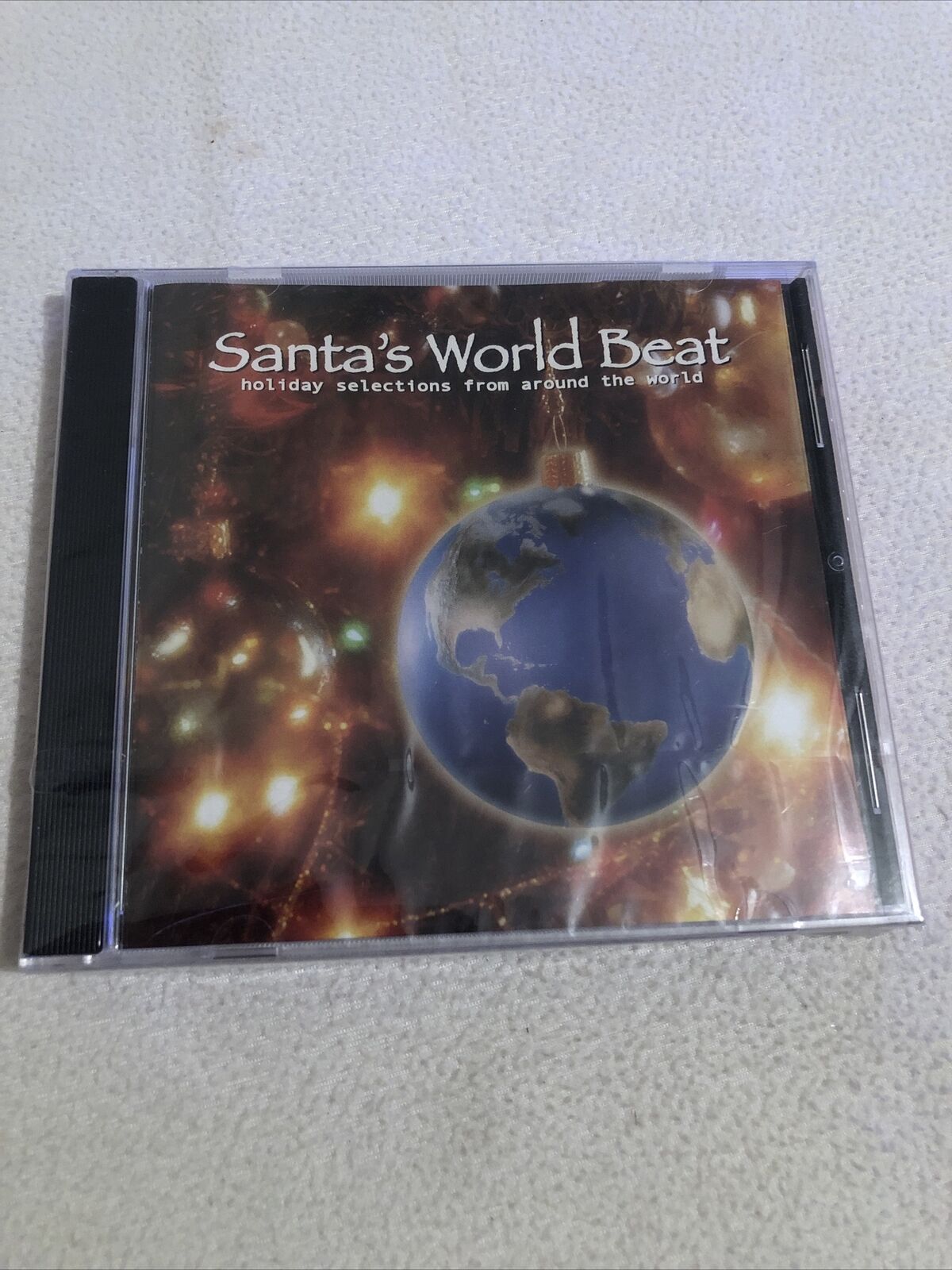 Santa\'s World Beat   Holiday selections from around the World.    New CD sealed