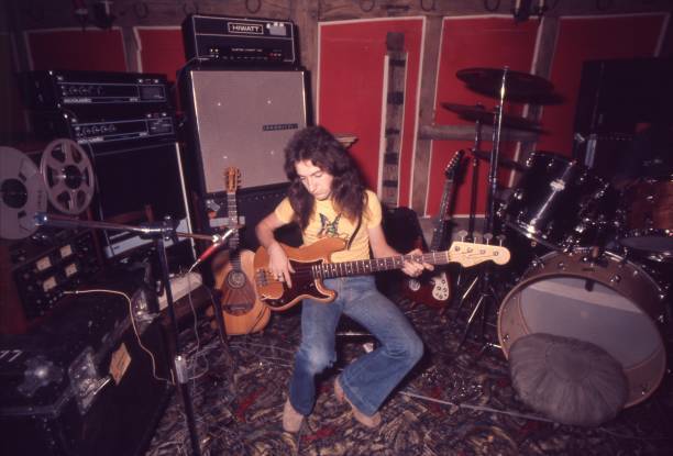 John Deacon of Queen playing a Fender Precision bass guitar at Rid- Old Photo