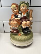 Vintage  HIMARK JAPAN   FIGURINE/MUSIC BOX   GIRL AND BOY SITTING ON FENCE PLAYS picture