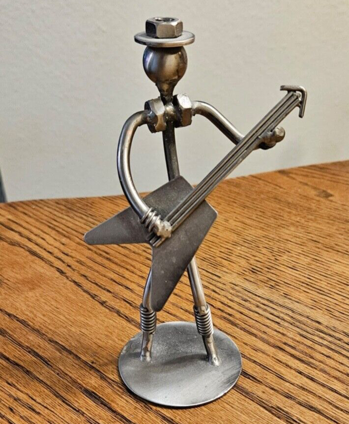 FLYING V BASS GUITAR NUTS AND BOLTS STATUE MUSICAL GUY  FELT BASE