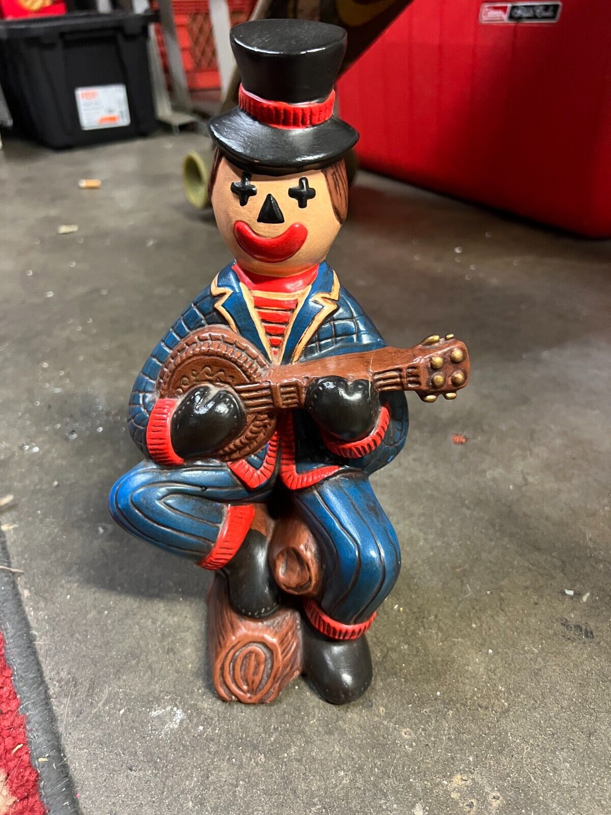 vintage clown figurine with banjo and top hat 