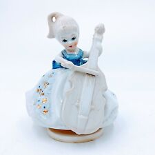 Vintage Music Box Genuine Porcelain. Girl Playing Cello. Works great. Pre-owned  picture