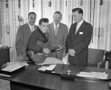 Entertainer Duane Eddy poses while signing a record deal 1958 Old Photo picture