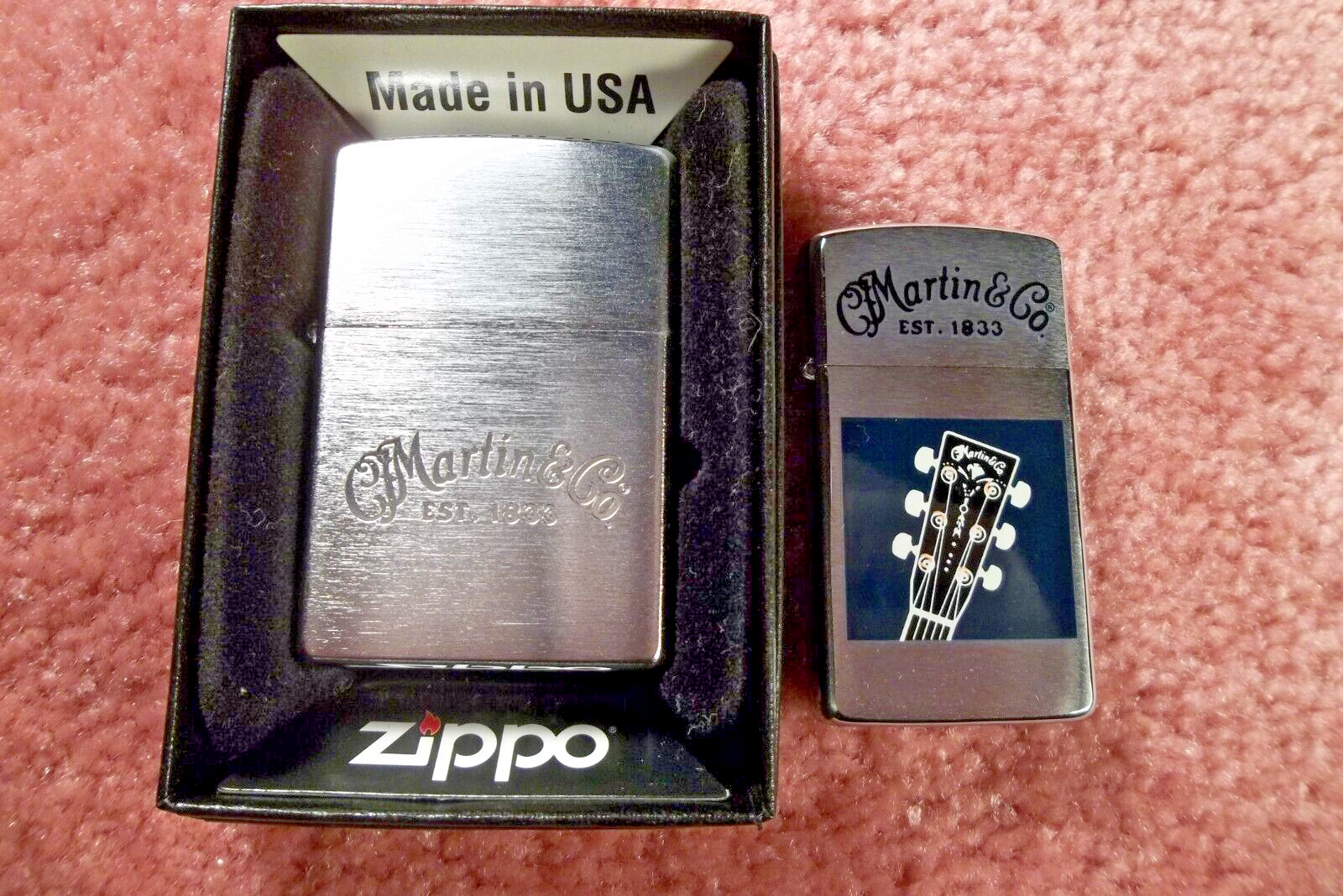 TWO ZIPPO MARTIN GUITAR LIGHTERS, ONE SLIM, ONE REGULAR, ONE STILL TAPED CHEAP