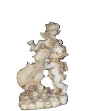 Vintage abstract statue of cherub angels playing music picture