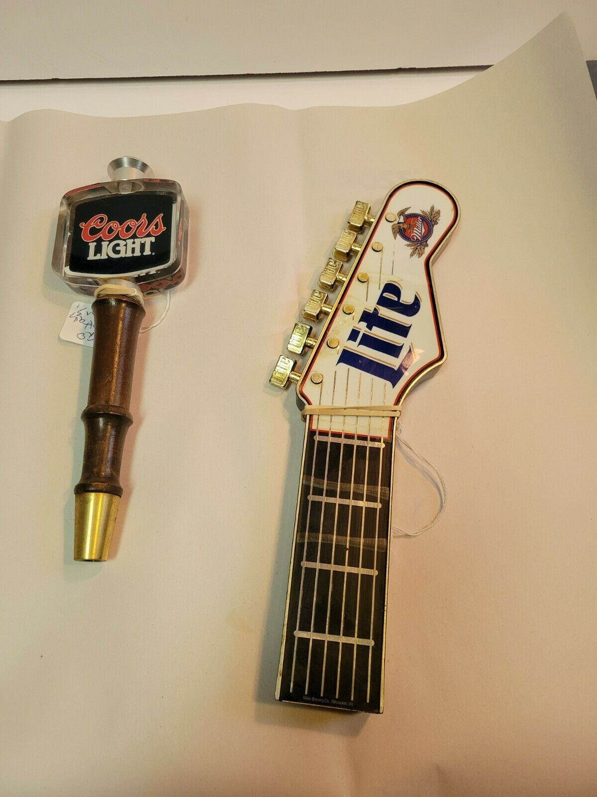 1 Coors Light and 1 Miller Lite Guitar beer tap handles
