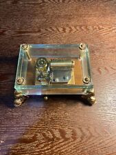 VINTAGE REUGE SWITZERLAND MUSIC BOX.  GLASS WITH BRASS DOLPHIN FEET. Sticker picture