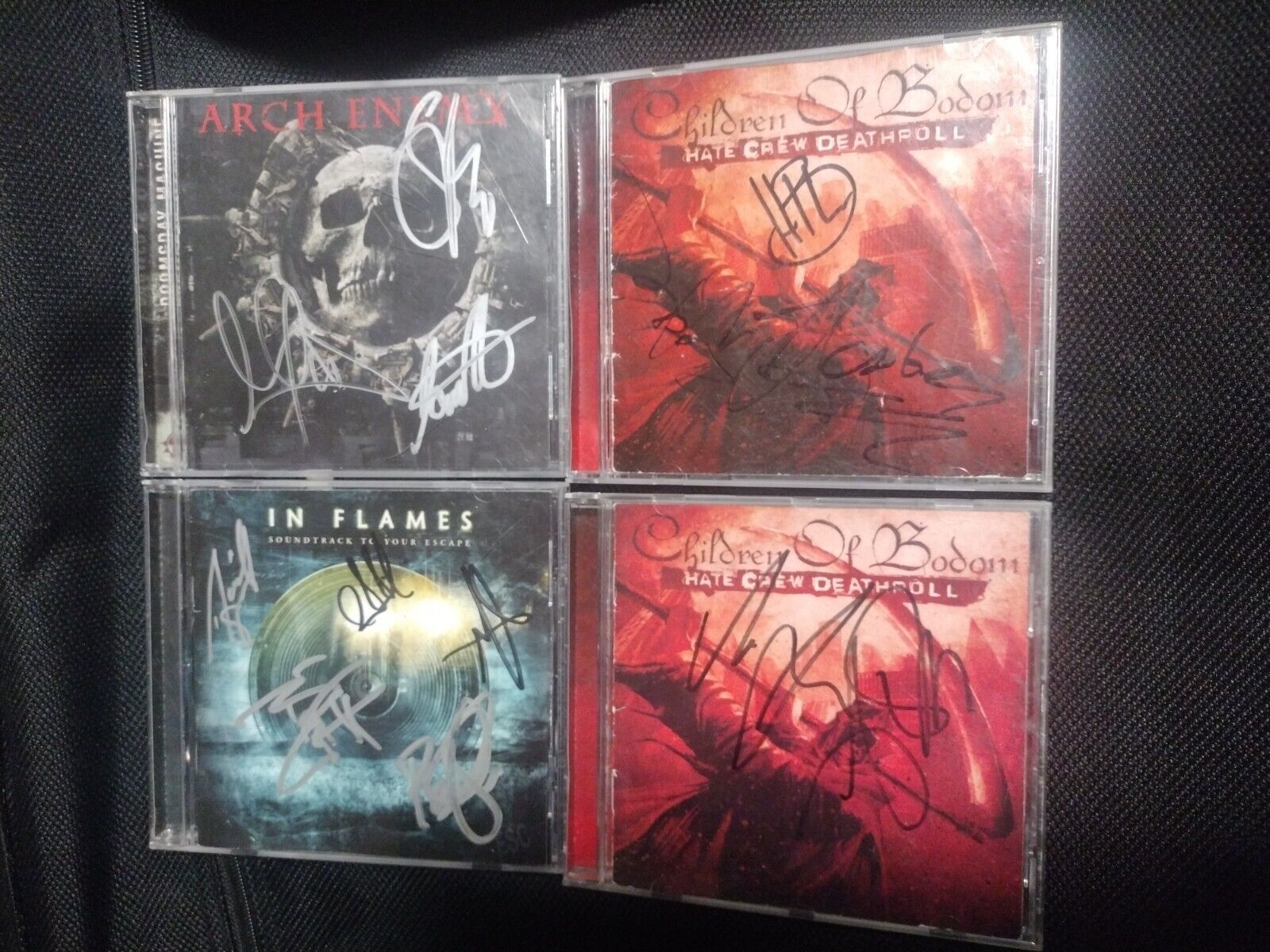 4 different autographed metal cds