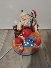 Vintage Santa Claus Figurine Lighted And Musical Sleeping in Chair with Pets picture