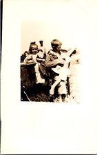 RPPC Adorable Children Playing Outdoors Guitar Chinese Porcelain Dolls Postcard picture