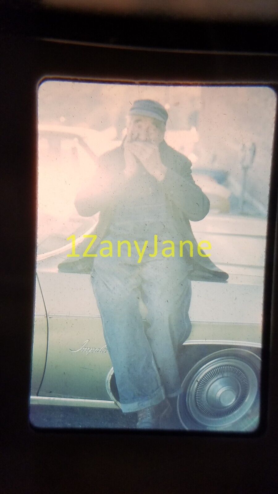 4616 vintage 35MM SLIDE photo MAN SITTING ON HOOD OF CAR PLAYING HARMONICA