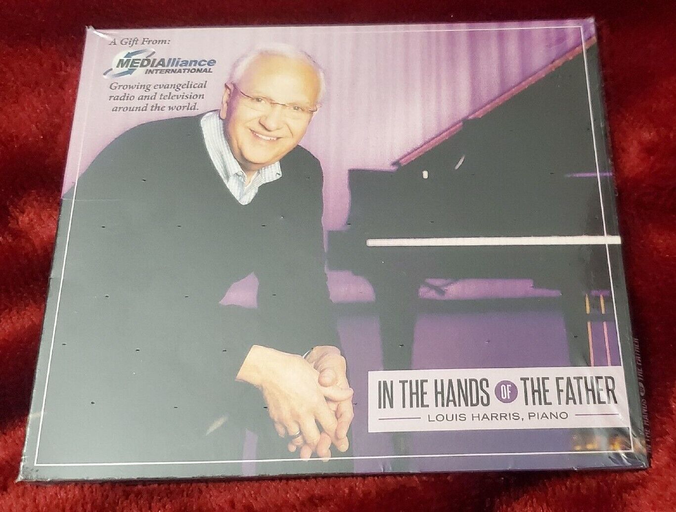 LOUIS HARRIS ON PIANO IN THE HANDS OF THE FATHER