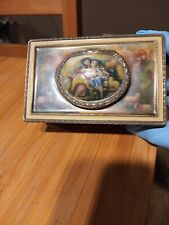 Vintage Victorian style metal music box with wind up humming bird picture
