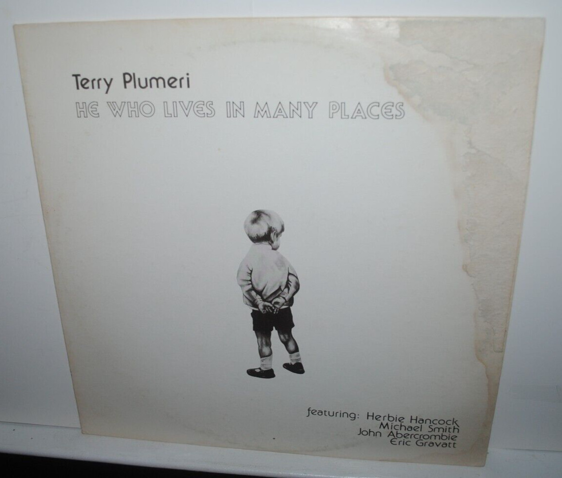 Terry Plumeri, HE WHO LIVES IN MANY LP record, record NM, jacket HEAVILY DAMAGED