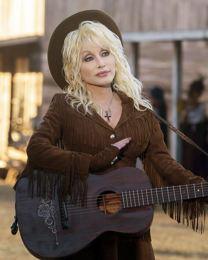 Dolly Parton poses with guitar in fringed western jacket & hat 24x36 inch Poster