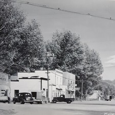 Real Photo Postcard RPPC Main Street Ennis, Montana. Banjo's Cafe, Theatre 1950s picture
