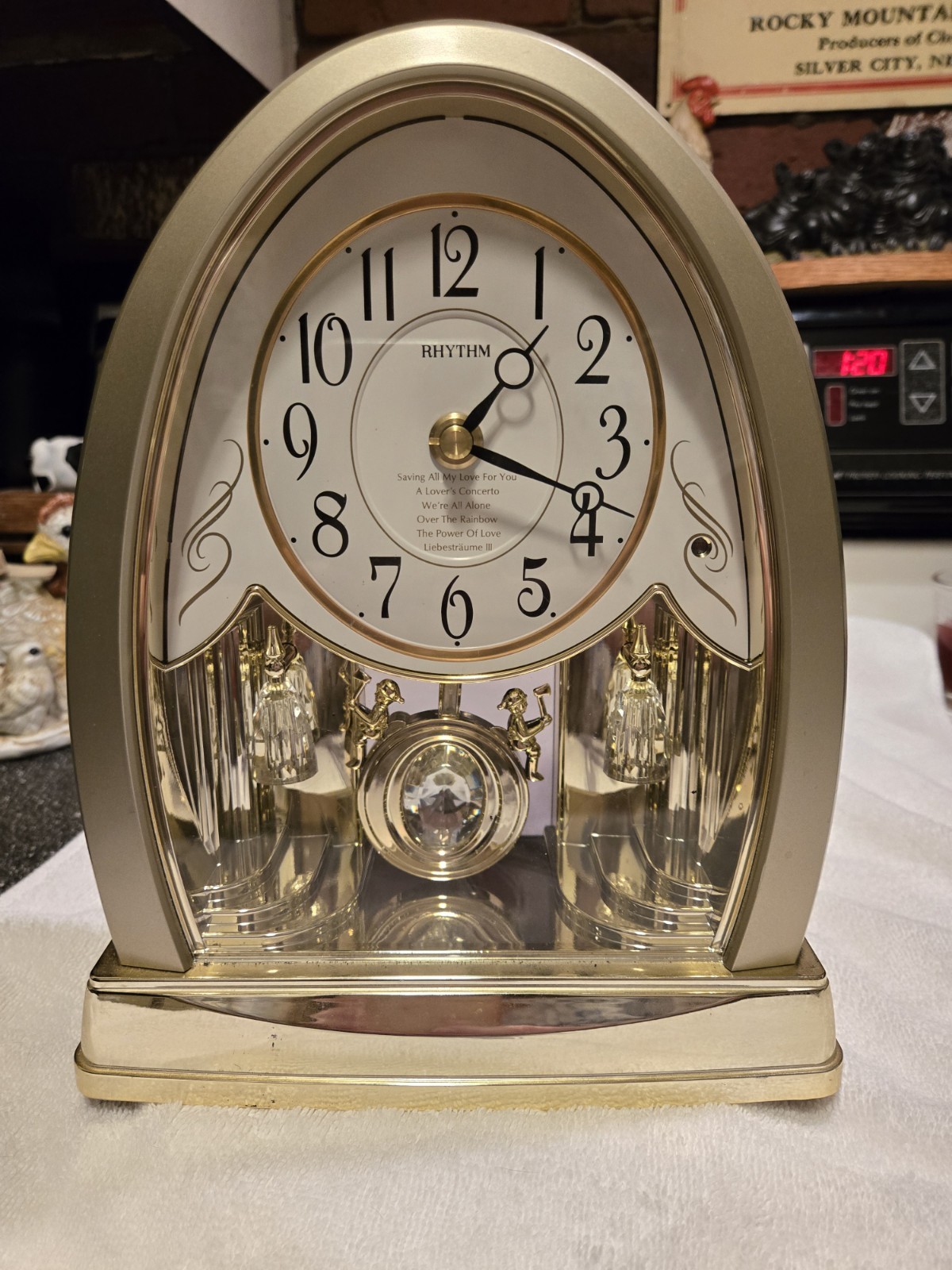 Rhythm Joyful Crystal Gold Musical Mantel Clock swinging crystal pendulum 