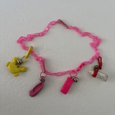 1980's Vintage Plastic Clip-On Bell Charm Necklace Pink Harmonica Ballet Crab picture