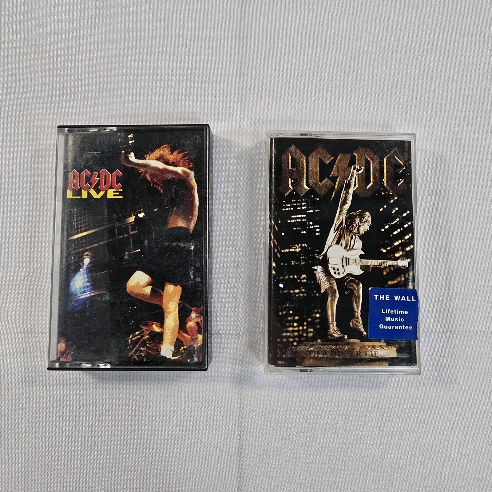 ​Lot of 2 AC/DC Cassette Tapes - AC/DC Live (1992) & Stiff Upper Lip (2000) Rock