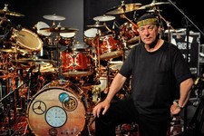 Neil Peart of Rush poses for a portrait with his DW drum kit the D- Old Photo picture