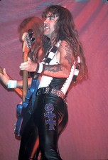 Bass guitarist Steve Harris is shown at a live concert appearance - Old Photo picture