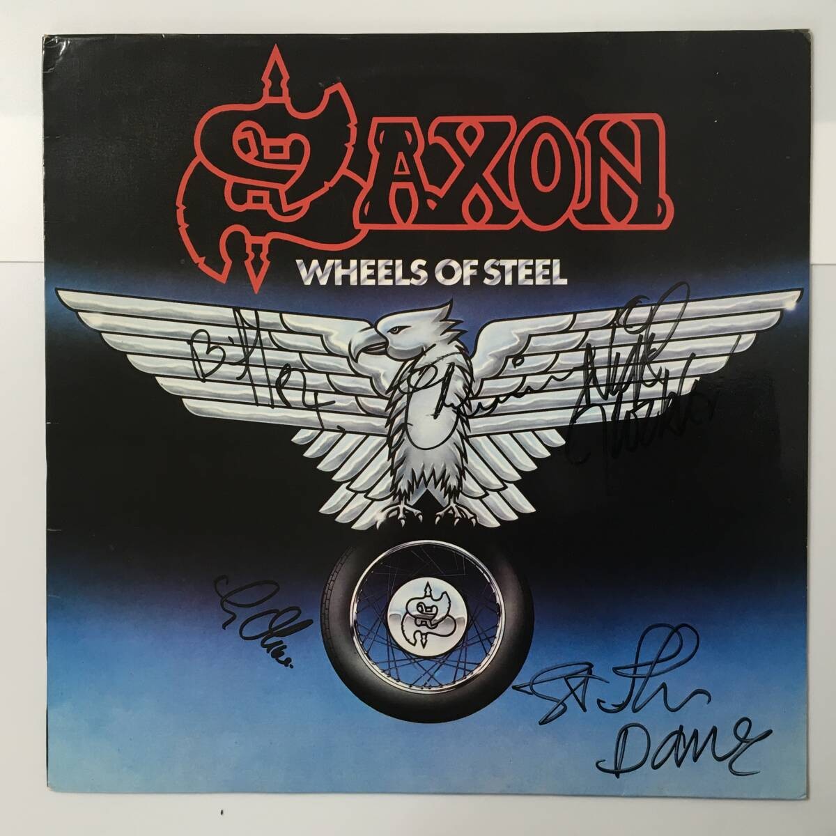 AUTOGRAPHED BY FULL MENBER SAXON WHEELS OF STEEL French edition, autographed by