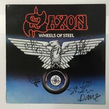 AUTOGRAPHED BY FULL MENBER SAXON WHEELS OF STEEL French edition, autographed by picture