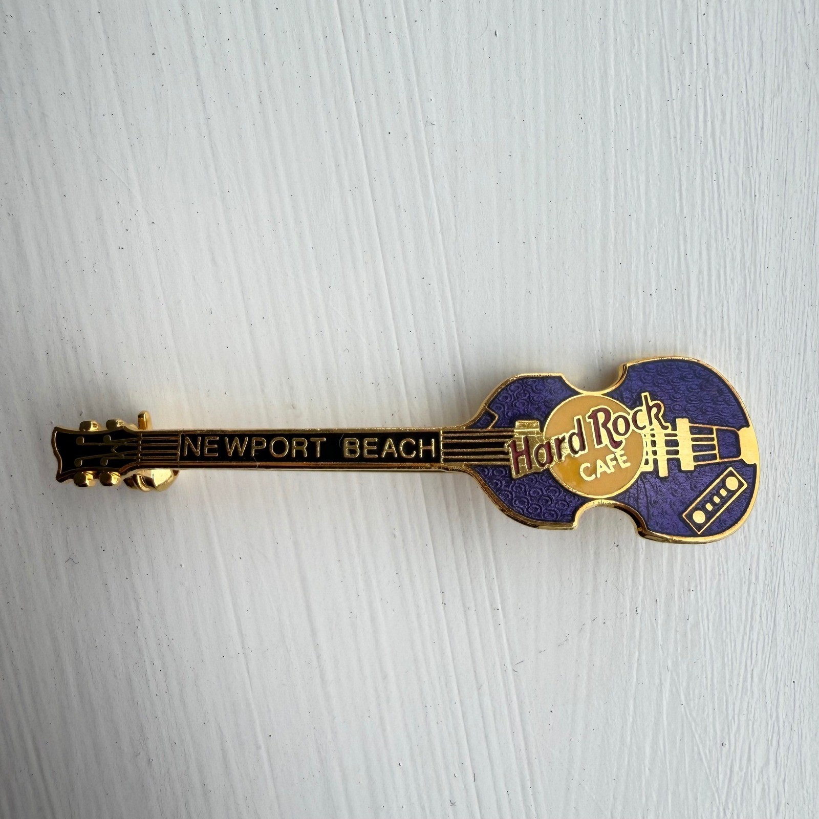 Hard Rock Cafe Newport Beach Hofner Bass Guitar Pin Purple Gold Tone Brooch