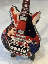 Oasis miniature Guitar - 10 inches tall - includes stand - UK stock picture