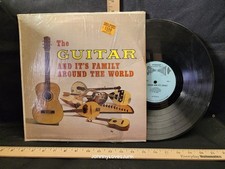 The Guitar And It's Family Around The World 33 LP Record Album Tested Plays picture
