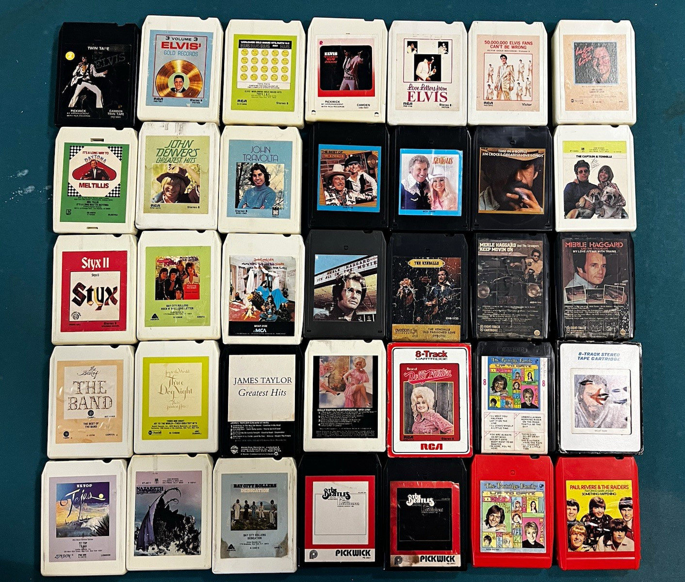 Large lot of 8 track tapes & holder. Beatles Elvis Dolly Parton and many more