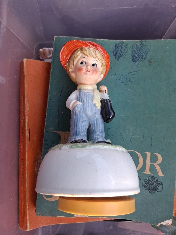 vintage Schmid Bros Japanese musical spinning figure depicting a boy in overalls