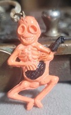 Vintage Celluloid SKELETON PLAYING A BANJO gumball prize jewelry  picture