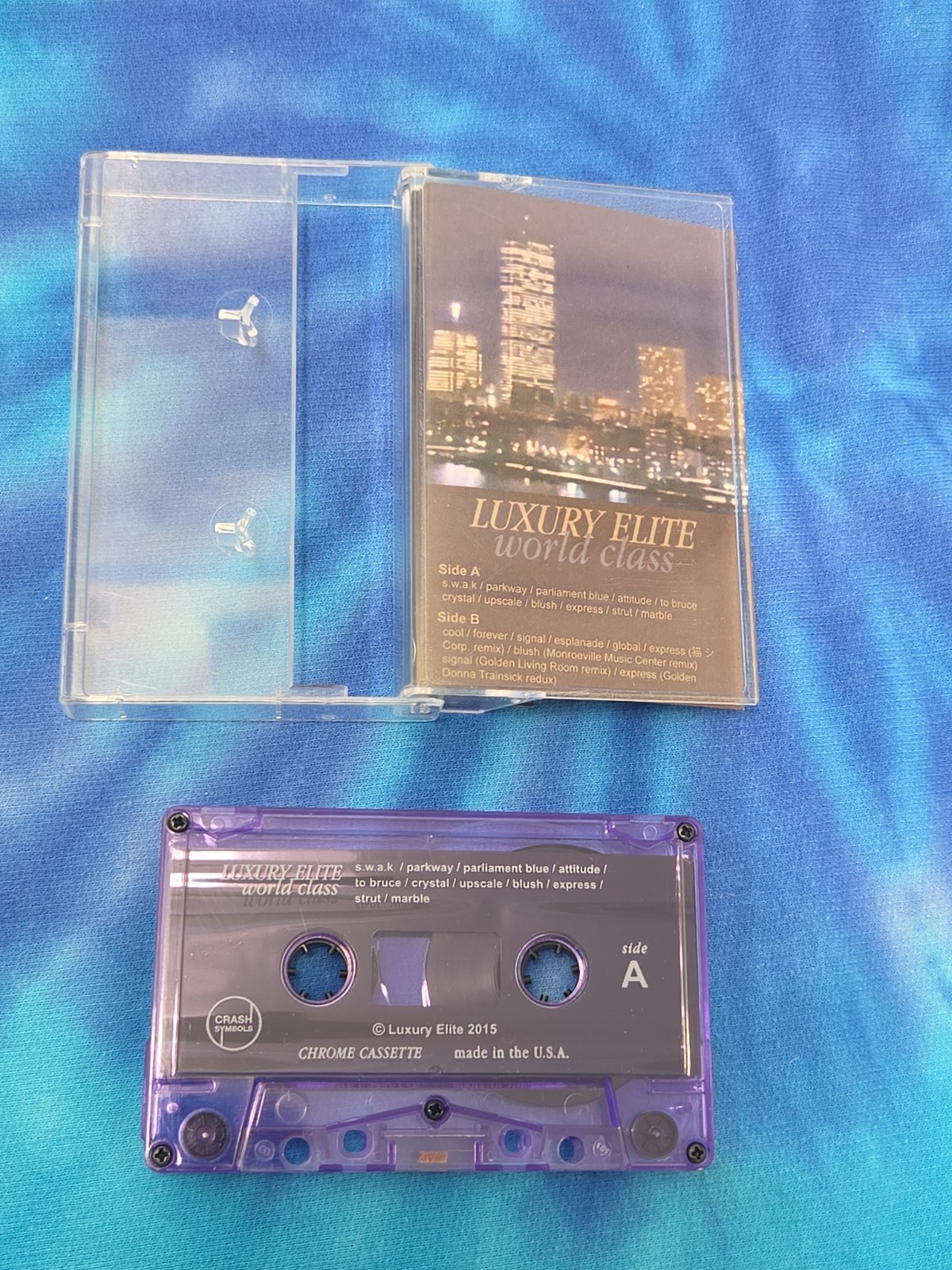 Luxury Elite - World Class Cassette Tape (Purple Shell, Crash Symbols, 2015)