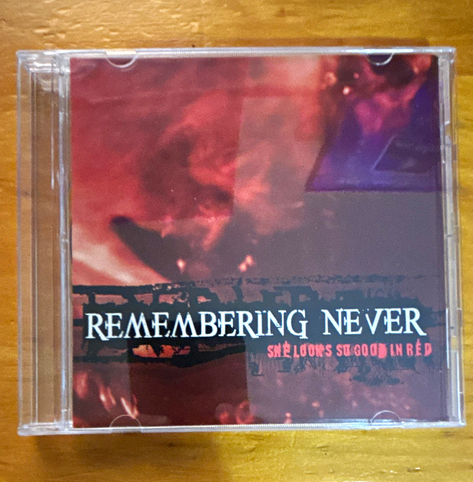 Remembering Never She Looks So Good in Red CD: CD & INSERT ONLY