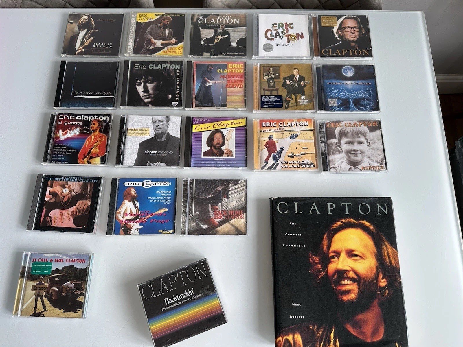 Collection of Eric Clapton including compact discs (CDs) Plus Clapton book 1991