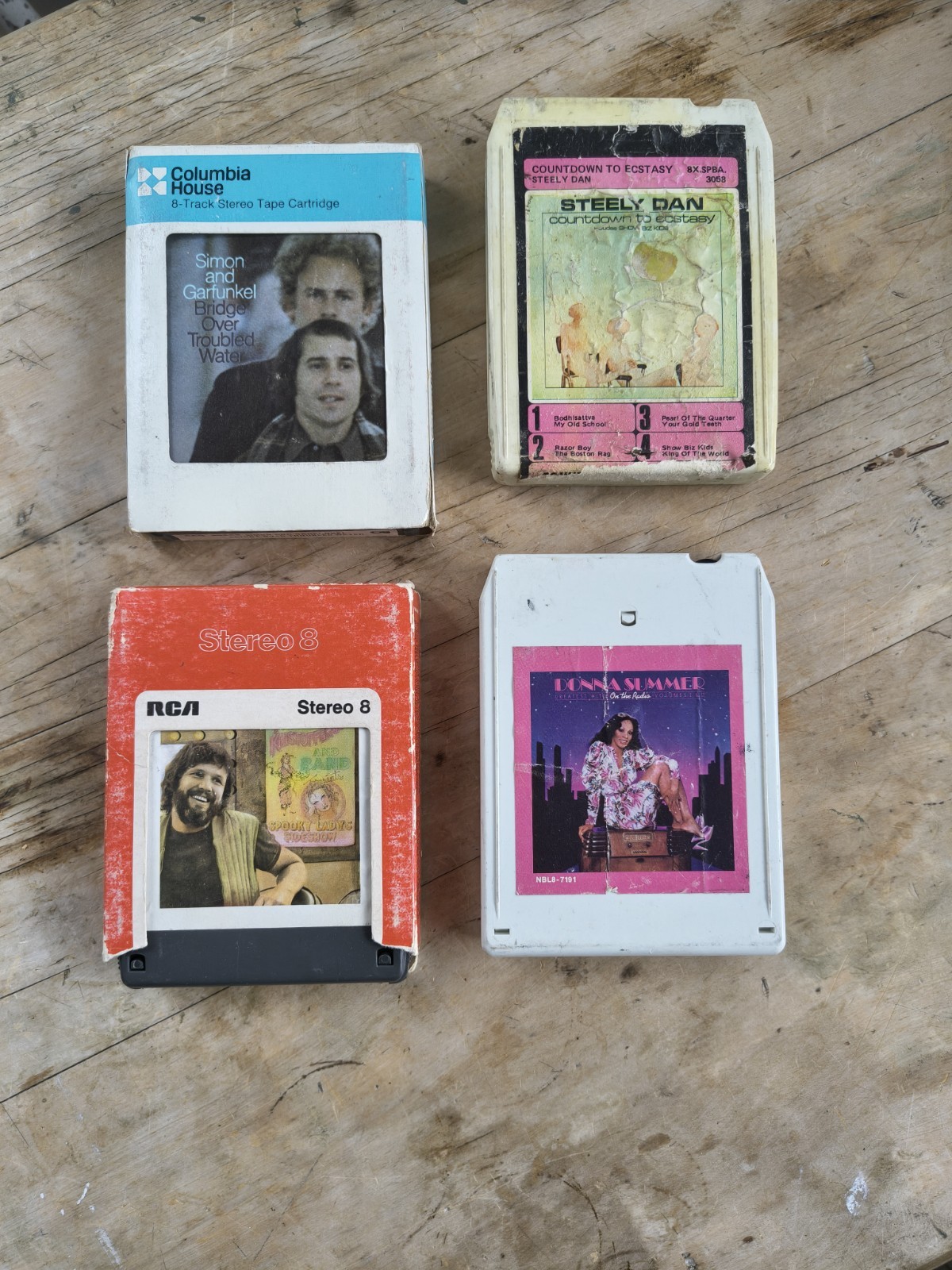 Vintage job lot of four original 8-track stereo tape cartridges from the 1970s.