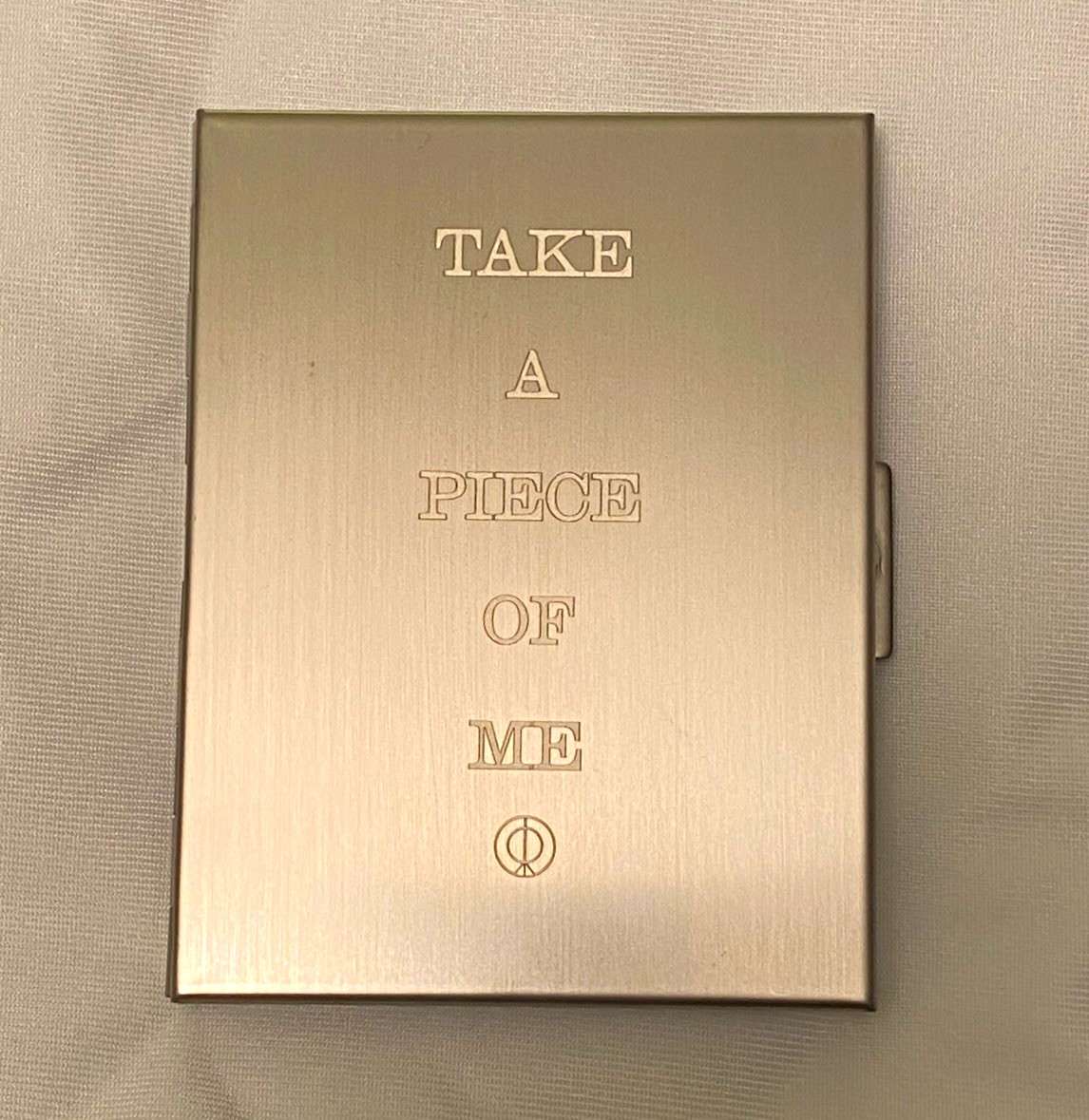 Rosalía Rosalia LUX Cigarette Case Engraved Reliquia TAKE A PIECE OF ME lyrics 