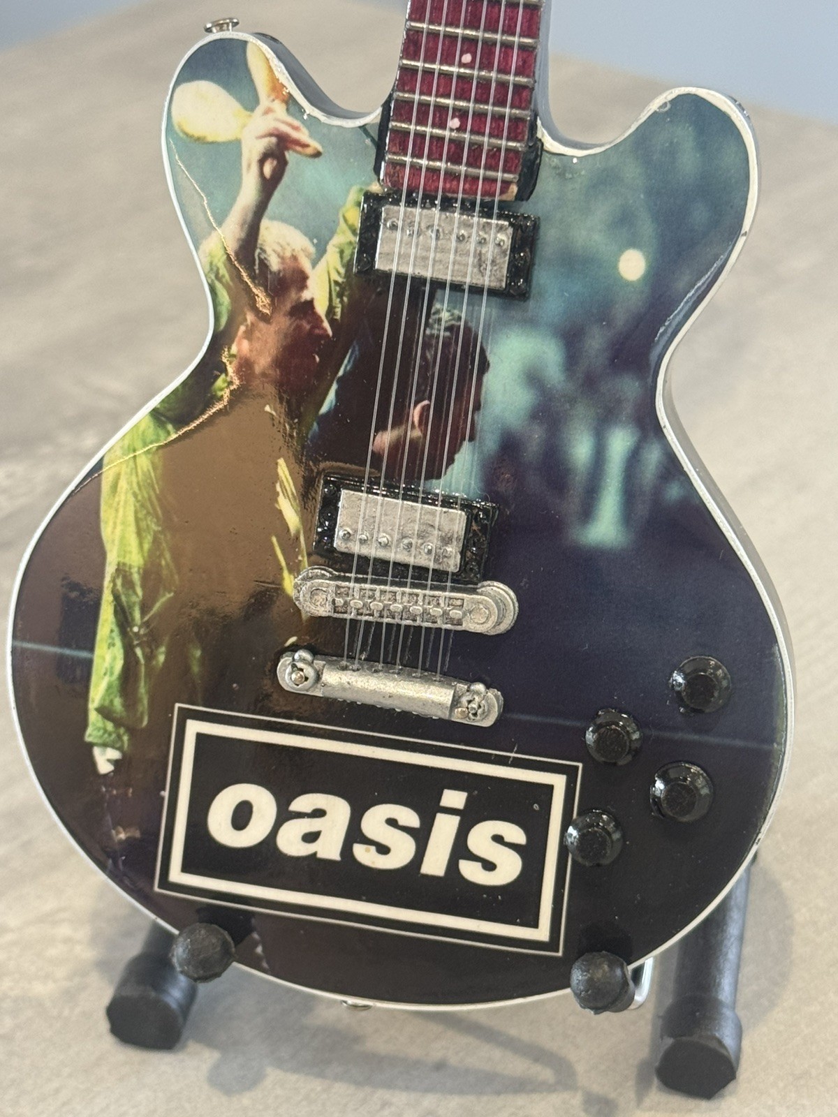 Oasis miniature Guitar - 10 inches tall - includes stand - UK stock